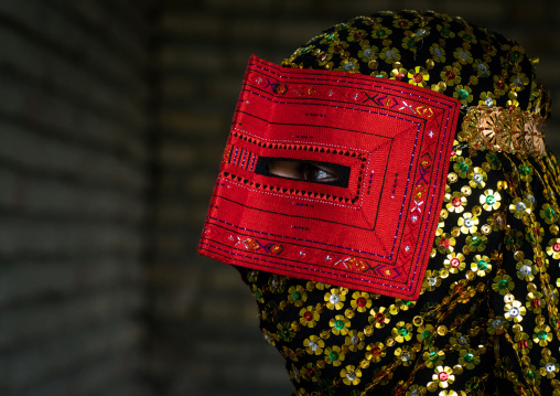 a bandari woman wearing a traditional mask called the burqa, Hormozgan, Minab, Iran