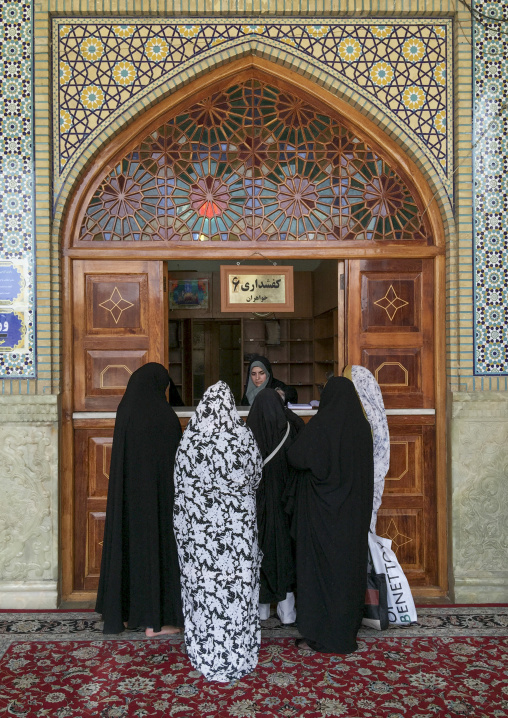 Woman in front og the cloackroom at the shah-e-cheragh mausoleum, Fars province, Shiraz, Iran