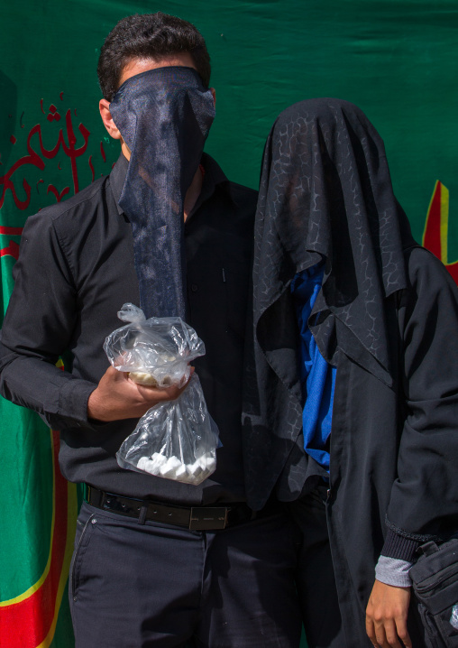 Iranian Shiite Muslim Couple Mourning Imam Hussein On The Day Of Tasua With Their Faces Covered By A Veil, Lorestan Province, Khorramabad, Iran