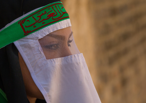 Iranian Shiite Muslim Woman Mourning Imam Hussein On The Day Of Tasua With Her Face Covered By A Veil, Lorestan Province, Khorramabad, Iran