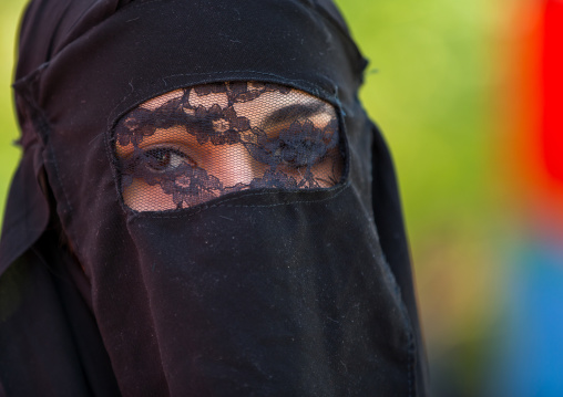 Iranian Shiite Muslim Woman Mourning Imam Hussein On The Day Of Tasua With Her Face Covered By A Veil, Lorestan Province, Khorramabad, Iran