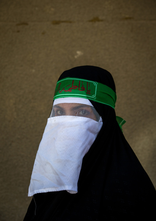 Iranian Shiite Muslim Woman Mourning Imam Hussein On The Day Of Tasua With Her Face Covered By A Veil, Lorestan Province, Khorramabad, Iran