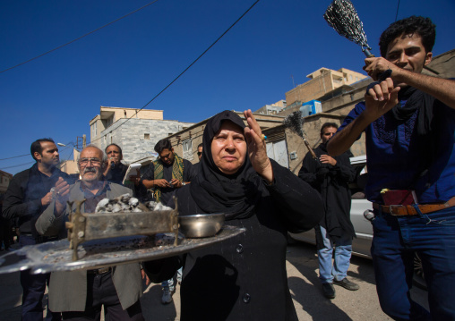 An Elderly Woman Carries Insence On Tasua Day In The Middle Of Shiite Men Who Beat Themselves With Chains, Lorestan Province, Khorramabad, Iran
