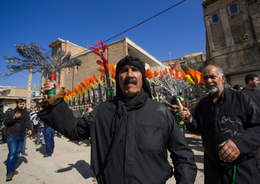 Iranian Shiite Muslim Men Beating Themselves With Chains In Front Of An Alam On Tasua Celebration, Lorestan Province, Khorramabad, Iran