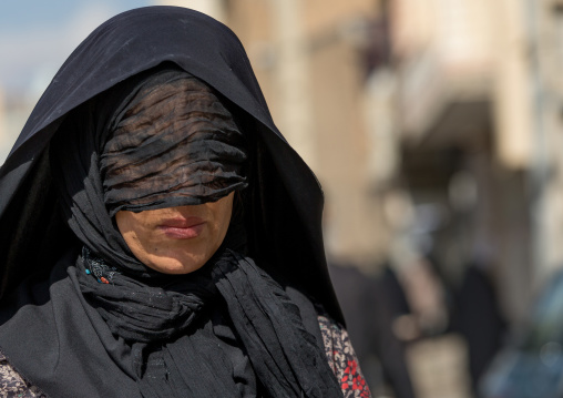 Iranian Shiite Muslim Woman Mourning Imam Hussein On The Day Of Tasua With Her Face Covered By A Veil, Lorestan Province, Khorramabad, Iran
