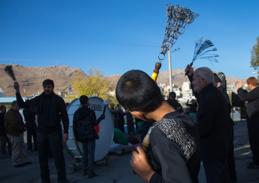 Iranian Shiite Boys Covered In Mud Are Beating Themselves With Iron Chains To Commemorate Ashura, The Day Of The Death Of Imam Hussein, Kurdistan Province, Bijar, Iran