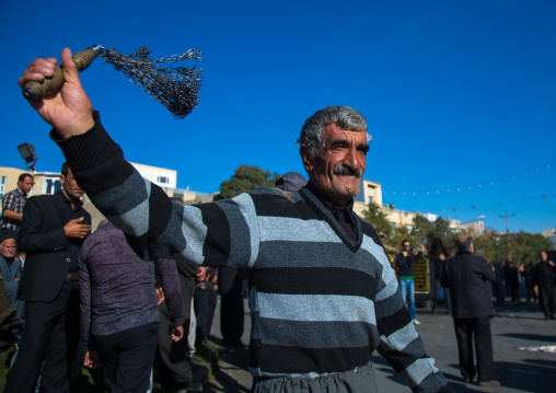 Iranian Shiite Man Is Beating Himself With Iron Chains To Commemorate Ashura, The Day Of The Death Of Imam Hussein, Kurdistan Province, Bijar, Iran