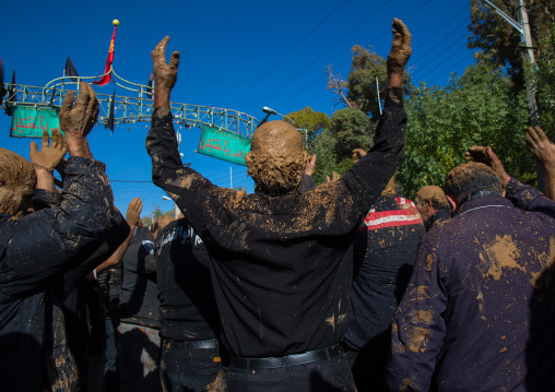 Iranian Shiite Muslim Men Covered In Mud, Chanting And Self-flagellating During Ashura, The Day Of The Death Of Imam Hussein, Kurdistan Province, Bijar, Iran