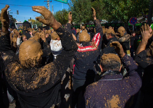 Iranian Shiite Muslim Men Covered In Mud, Chanting And Self-flagellating During Ashura, The Day Of The Death Of Imam Hussein, Kurdistan Province, Bijar, Iran
