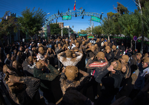 Iranian Shiite Muslim Men Covered In Mud, Chanting And Self-flagellating During Ashura, The Day Of The Death Of Imam Hussein, Kurdistan Province, Bijar, Iran