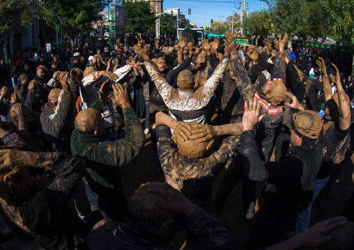 Iranian Shiite Muslim Men Covered In Mud, Chanting And Self-flagellating During Ashura, The Day Of The Death Of Imam Hussein, Kurdistan Province, Bijar, Iran