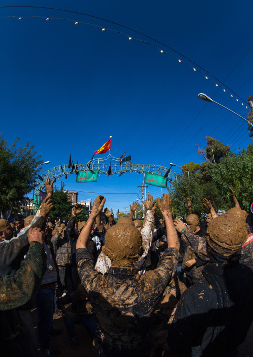 Iranian Shiite Muslim Men Covered In Mud, Chanting And Self-flagellating During Ashura, The Day Of The Death Of Imam Hussein, Kurdistan Province, Bijar, Iran