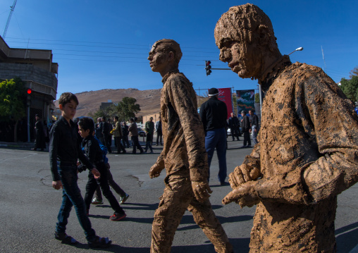 Iranian Shiite Muslim Men Covered In Mud During Ashura Day, Kurdistan Province, Bijar, Iran