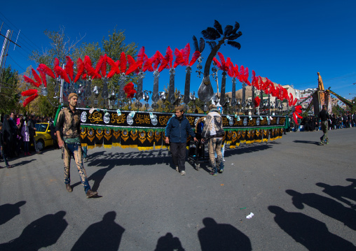 An Iranian Man Carries An Alam Is Helped By Shiite Muslim Mourners To Keep His Balance On Ashura, The Day Of The Death Of Hussein, Kurdistan Province, Bijar, Iran