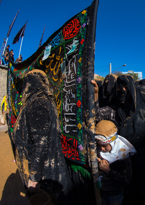 Iranian Shiite Muslim Girl Covered In Mud During Ashura, The Day Of The Death Of Imam Hussein, Kurdistan Province, Bijar, Iran