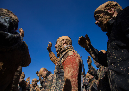 Iranian Shiite Muslim Men Covered In Mud, Chanting And Self-flagellating During Ashura, The Day Of The Death Of Imam Hussein, Kurdistan Province, Bijar, Iran