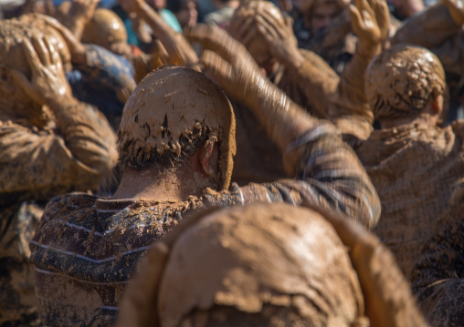 Iranian Shiite Muslim Men Covered In Mud, Chanting And Self-flagellating During Ashura Day, Kurdistan Province, Bijar, Iran