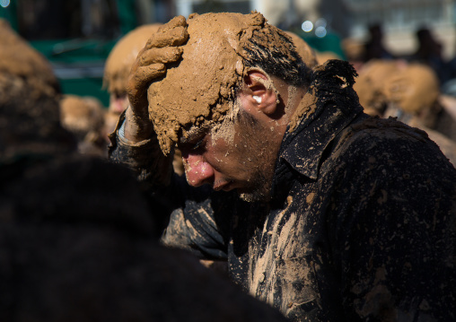 Iranian Shiite Muslim Man Covered In Mud, Chanting And Self-flagellating During Ashura Day, Kurdistan Province, Bijar, Iran