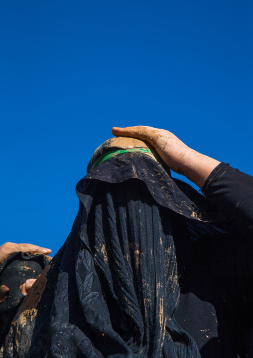 Iranian Shiite Muslim Woman Covered In Mud, Chanting And Self-flagellating During Ashura, The Day Of The Death Of Imam Hussein, Kurdistan Province, Bijar, Iran