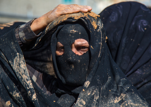 Iranian Shiite Muslim Woman Covered In Mud, Chanting And Self-flagellating During Ashura, The Day Of The Death Of Imam Hussein, Kurdistan Province, Bijar, Iran