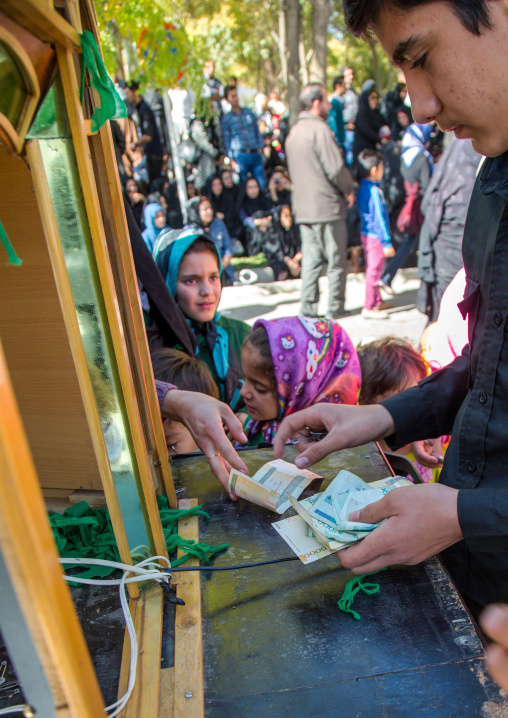 Iranian Shiite People Buying Green Ribbons To Make Wishes On Ashura, The Day Of The Death Of Imam Hussein, Kurdistan Province, Bijar, Iran
