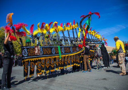 An Iranian Man Carries An Alam Is Helped By Shiite Muslim Mourners To Keep His Balance On Ashura, The Day Of The Death Of Hussein, Kurdistan Province, Bijar, Iran
