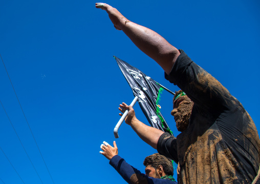 Iranian Shiite Muslim Men Covered In Mud, Chanting And Self-flagellating During Ashura, The Day Of The Death Of Imam Hussein, Kurdistan Province, Bijar, Iran