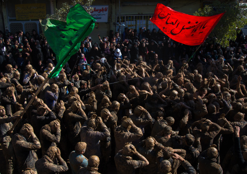 Iranian Shiite Muslim Men Covered In Mud, Chanting And Self-flagellating During Ashura, The Day Of The Death Of Imam Hussein, Kurdistan Province, Bijar, Iran