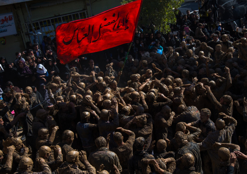 Iranian Shiite Muslim Men Covered In Mud, Chanting And Self-flagellating During Ashura, The Day Of The Death Of Imam Hussein, Kurdistan Province, Bijar, Iran