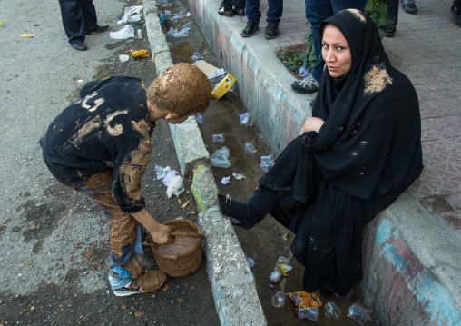 Boy Carrying A Bucket Of Mud During Ashura Celebration, The Day Of The Death Of Imam Hussein, Kurdistan Province, Bijar, Iran