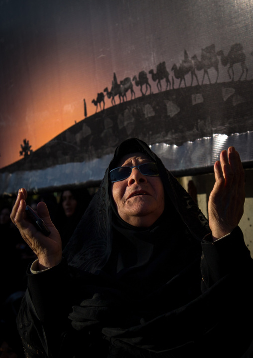 Iranian Shiite Muslim Old Woman Praying With Hands Raised During Ashura Celebration, The Day Of The Death Of Imam Hussein, Kurdistan Province, Bijar, Iran
