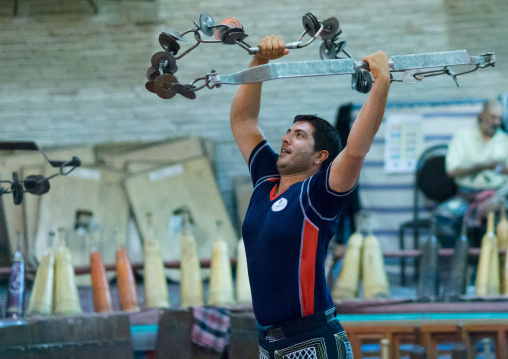 Iranian Man Training With Kabbadeh Chain And Bow At Saheb A Zaman Club Zurkhaneh, Yazd Province, Yazd, Iran