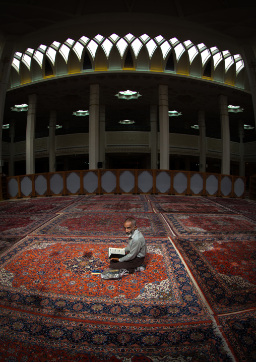 Iranian Shiite Muslim Man Reading The Koran In Fatima Al-masumeh Mosque, Fars Province, Shiraz, Iran