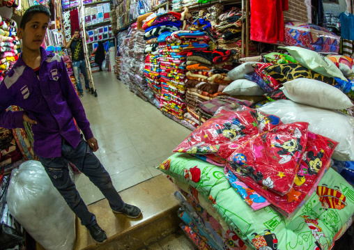 Vendor In The Bazaar With Mickey Mouse Logos On Blankets, Fars Province, Shiraz, Iran