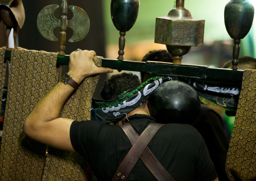 An Iranian Man Carries An Alam Is Helped By Shiite Muslim Mourners To Keep His Balance On Ashura, The Day Of The Death Of Hussein, Isfahan Province, Kashan, Iran