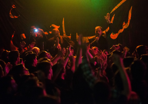 Iranian Shiite Muslim Man Leading Recitations And Songs With Mourners During Muharram, Isfahan Province, Kashan, Iran
