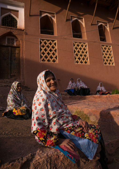 Portrait Of Iranian Women Wearing Traditional Floreal Chadors In Zoroastrian Village, Isfahan Province, Abyaneh, Iran