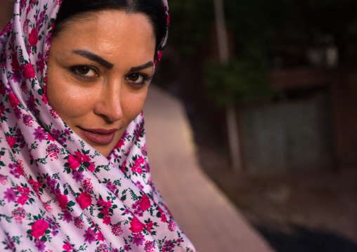 Portrait Of An Iranian Woman Wearing Traditional Floreal Chador In Zoroastrian Village, Isfahan Province, Abyaneh, Iran