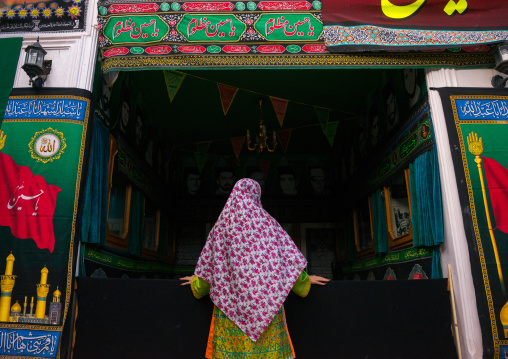 Iranian Woman Wearing Traditional Floreal Chador In Jam’e Mosque Decorated For Ashura Celebration, Isfahan Province, Abyaneh, Iran