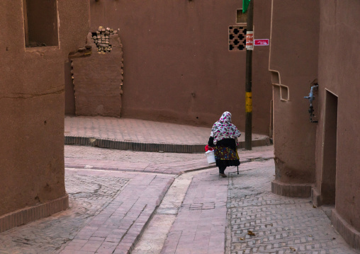 Portrait Of An Iranian Woman Wearing Traditional Floreal Chador In Zoroastrian Village, Isfahan Province, Abyaneh, Iran