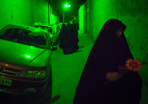 Iranian Women Wearing Chadors In The Street Lighten By Green Light During Muharram Celebration, Isfahan Province, Kashan, Iran
