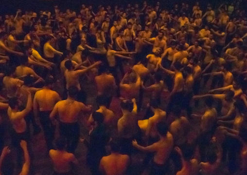 Iranian Shiite Muslim Mourners From The Mad Of Hussein Community Chanting And Self-flagellating In Circle During Muharram, Isfahan Province, Kashan, Iran