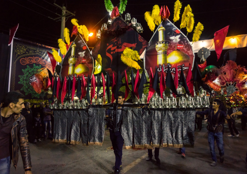 An Iranian Man Carries An Alam Is Helped By Shiite Muslim Mourners To Keep His Balance On Ashura, The Day Of The Death Of Hussein, Isfahan Province, Kashan, Iran