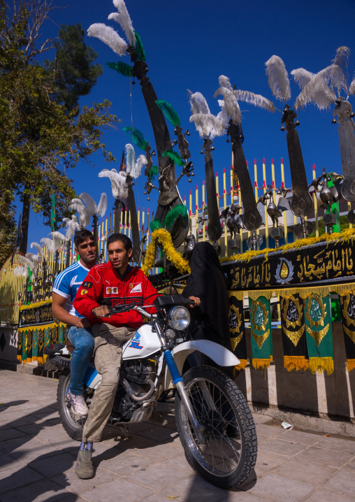 Iranian Men On Mototbike In Front Of An Alam On Tasua Celebration, Lorestan Province, Khorramabad, Iran