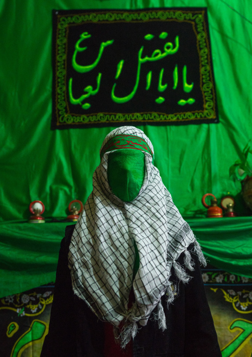 Iranian Young Man With Green Veil Covering His Face During Chehel Menbari Festival On Tasua To Commemorate The Martyrdom Of Hussein, Lorestan Province, Khorramabad, Iran