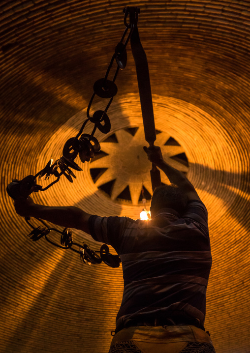 Iranian Man Training With Kabbadeh Chain And Bow At Saheb A Zaman Club Zurkhaneh, Yazd Province, Yazd, Iran