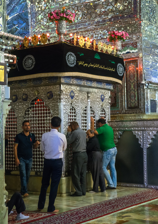 Men Mourning In Front Of A Grave In The Shah-e-cheragh Mausoleum, Fars Province, Shiraz, Iran