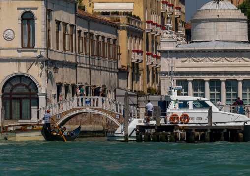 Bridge and boat in fron tof old buildings on the grand canal, Veneto Region, Venice, Italy