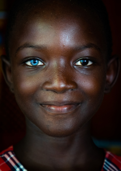 Beautiful african girl with heterochromia iridis causing two different colored eyes, Moyen-Comoé, Abengourou, Ivory Coast