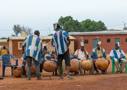 African musicians playing koras during Boloye dance of the panther man, Savanes district, Waraniene, Ivory Coast